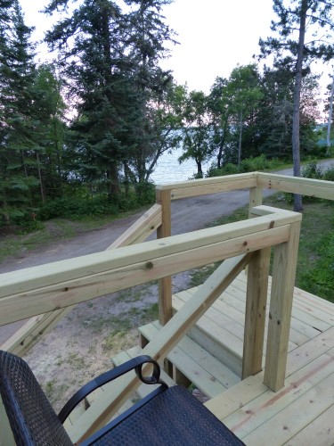 Deck with glider overlooks White Iron Lake.